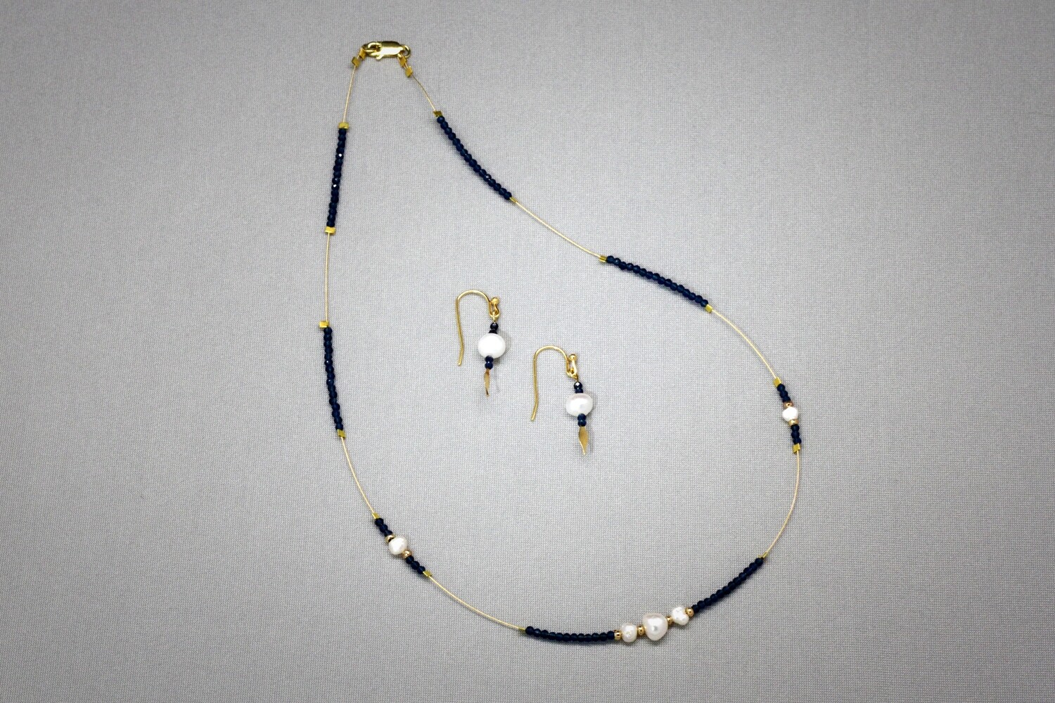 Sapphire, pearl and gold floating necklace and earrings