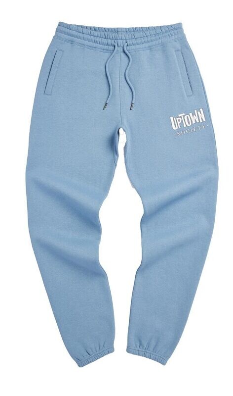 Cloudy blue  athletic jogger pants with a drawstring waist, featuring the text &quot;uptown society&quot; embroidered in white on the upper left thigh. the pants have cuffed ankles and a relaxed fit.