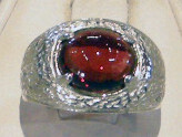 KWH SS RING W/8X10MM GARNET CAB