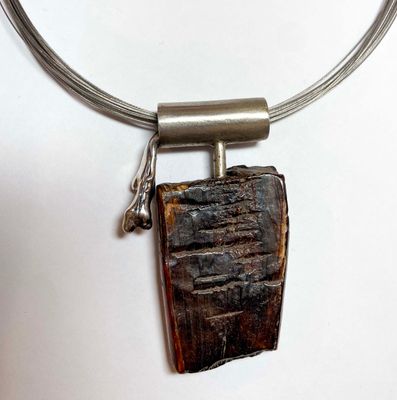 SS BRUSHED PENDANT W/MASTODON ARTIFACT