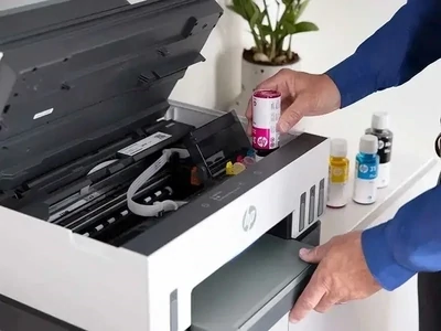 Imprimante à réservoirs rechargeables