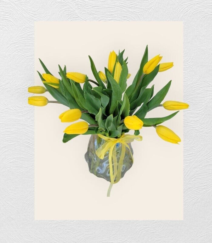 Sunshine Serenade: Yellow Tulips in Glass Vase