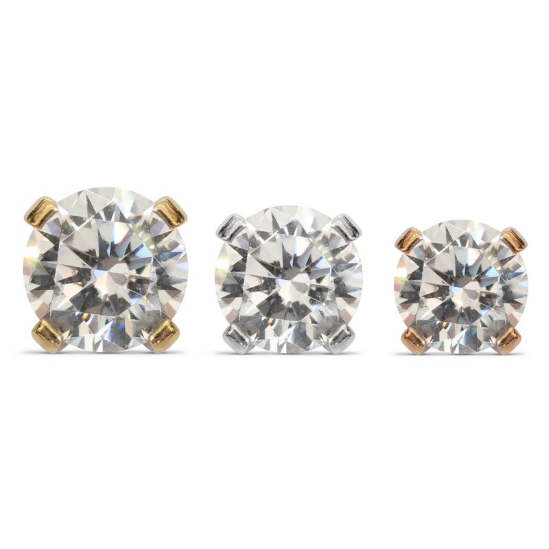 Close-up image of three round-cut gemstones in prong settings, displayed side by side. The prongs are in different metal colors: the left stone has yellow gold prongs, the center stone has white gold prongs, and the right stone has rose gold prongs.