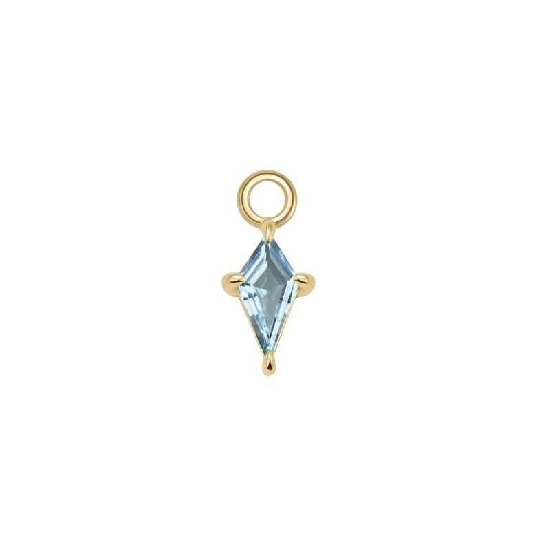 The Jace Charm in 14k yellow gold with a kite shaped sky blue topaz stone, made by Modern Mood.