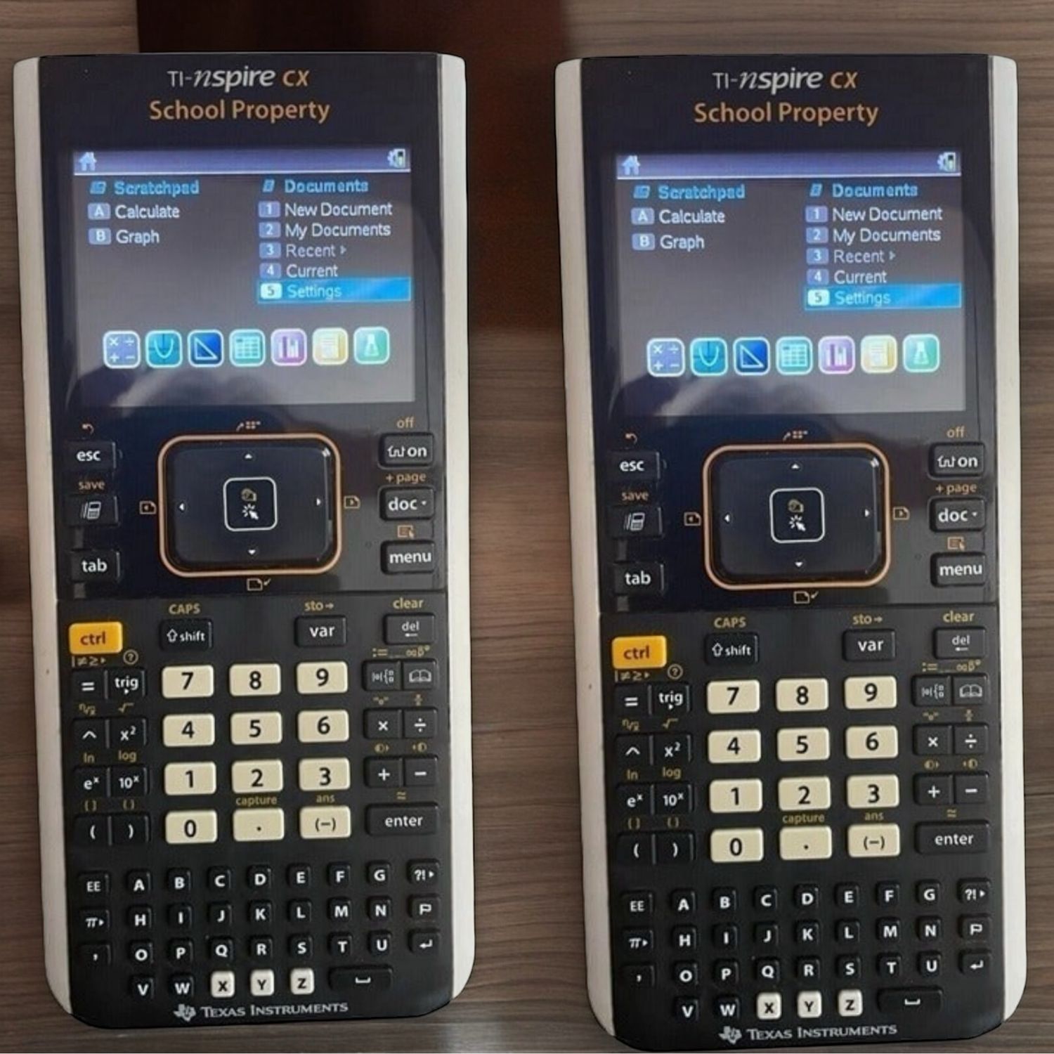 2 Texas Instruments TI-Nspire CX Graphing Calculators  - Renewed (Random One)
