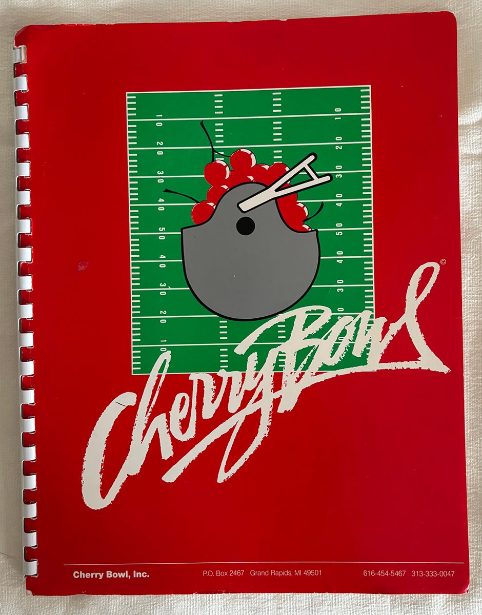 Item.S.169.1984 Cherry Bowl Guide and Michigan State Football Guide (with autographs)