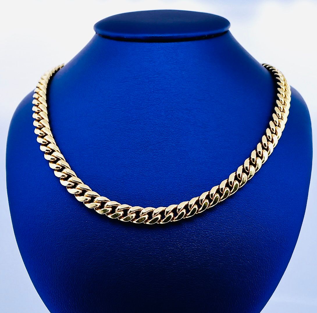 Cadena Cubana 14k  Dimensiones 22" x 7mm Peso 30.4g CA100011477