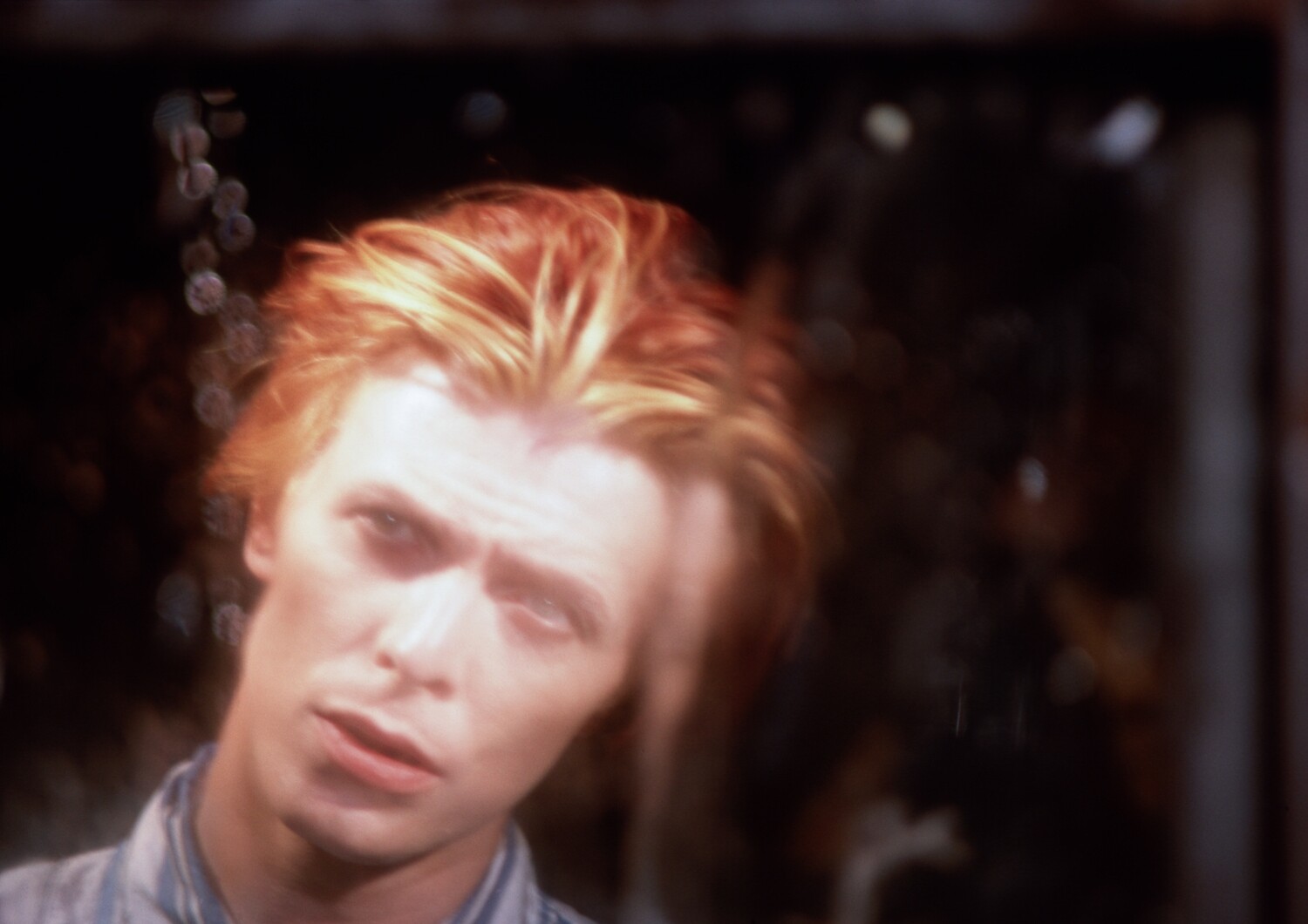 David Bowie:  TMWFTE, through window on set, 1975 - MAC055
