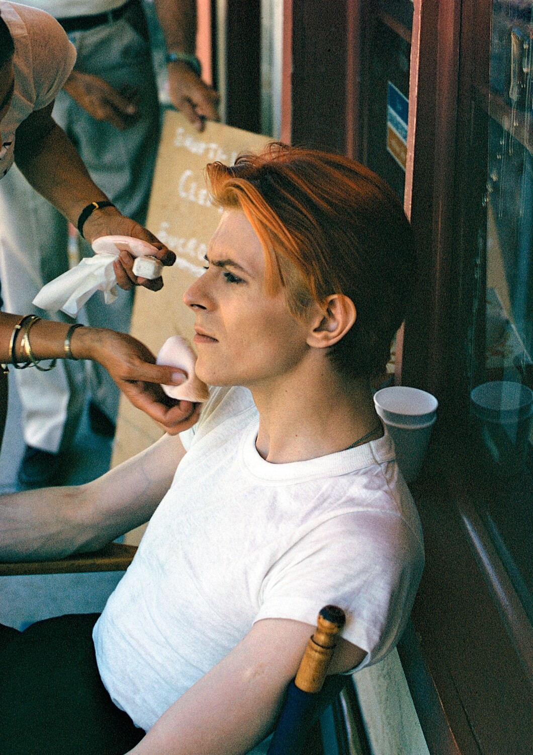 David Bowie: TMWFTE make up refresh on set, 1975 - MAC025