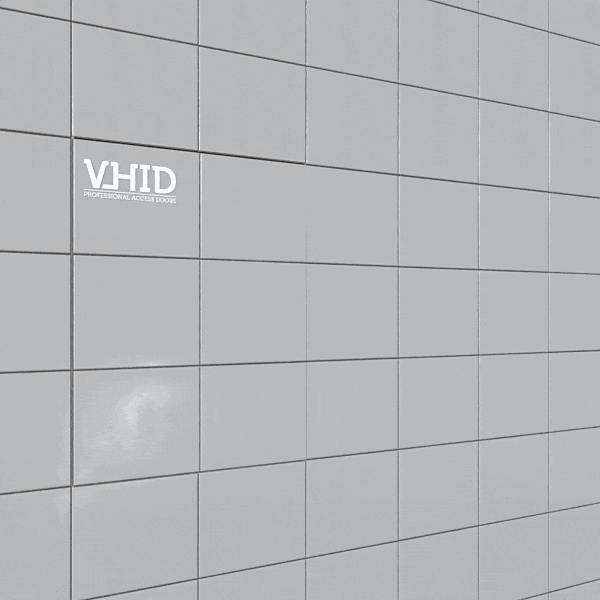 Hidden tile access door, sliding parallel to the wall, mod. SLIDE. Push to Open