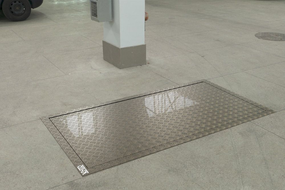 Technical floor hatch for premises, with a corrugated steel sheet lid, opening with the help of an electric actuator, mod. Electric PANZER. Black steel