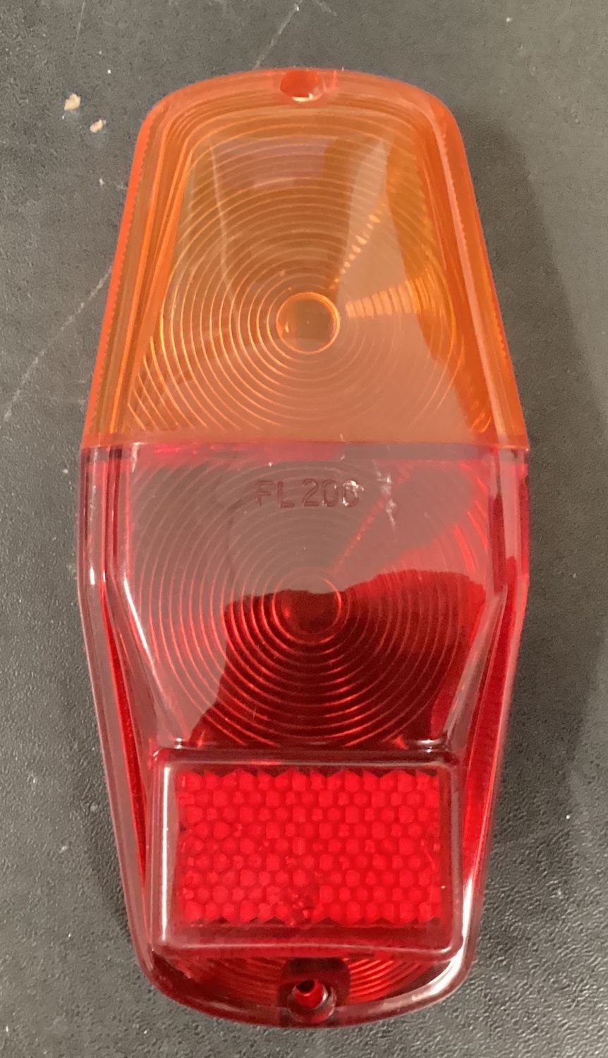Lens for combination lamp