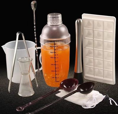 Boba shop supplies, including tea buckets, shaker cups, digital scales, spoons, measuring cups, thermometers, timers, and plastic cups