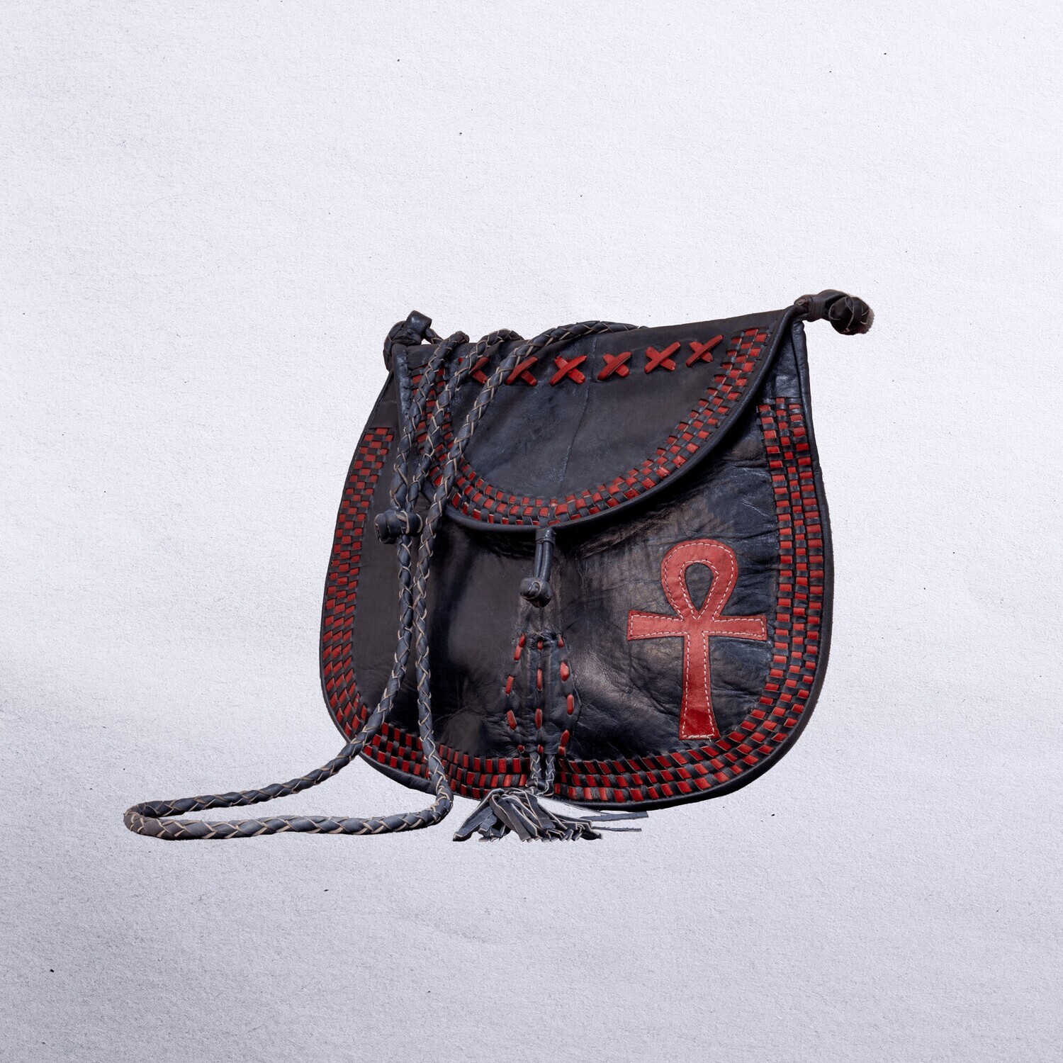Beautiful cross-body leather bag. Has braided leather straps with Ankh adornment. Inside and outside pockets., Color: Red/Black