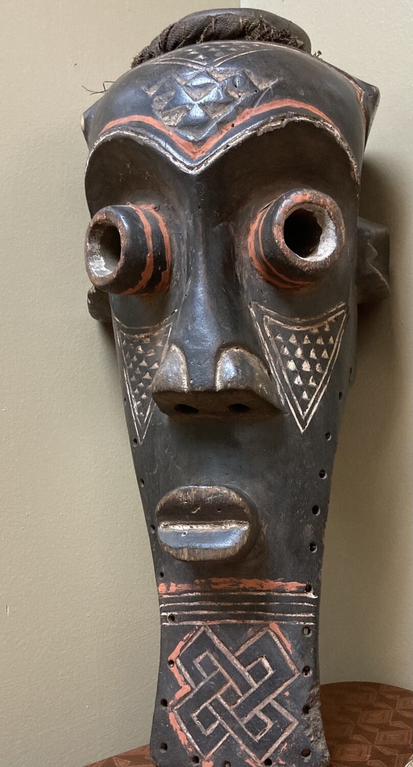 Kete of the Kuba confederation: initiation mask wooden with kaolin white and tukala red pigment. 20 1/4&quot; tall x 9&quot; wide (ear to ear). Dem Rep of Congo