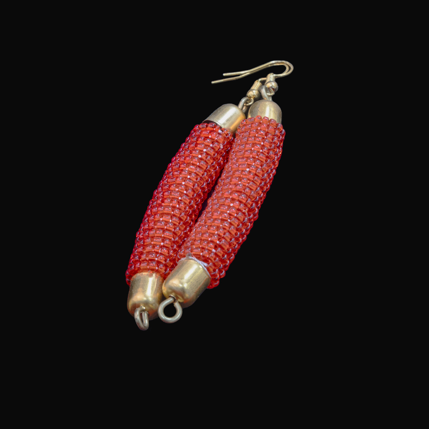 Red beaded necklace and earring set with tiered pendant.