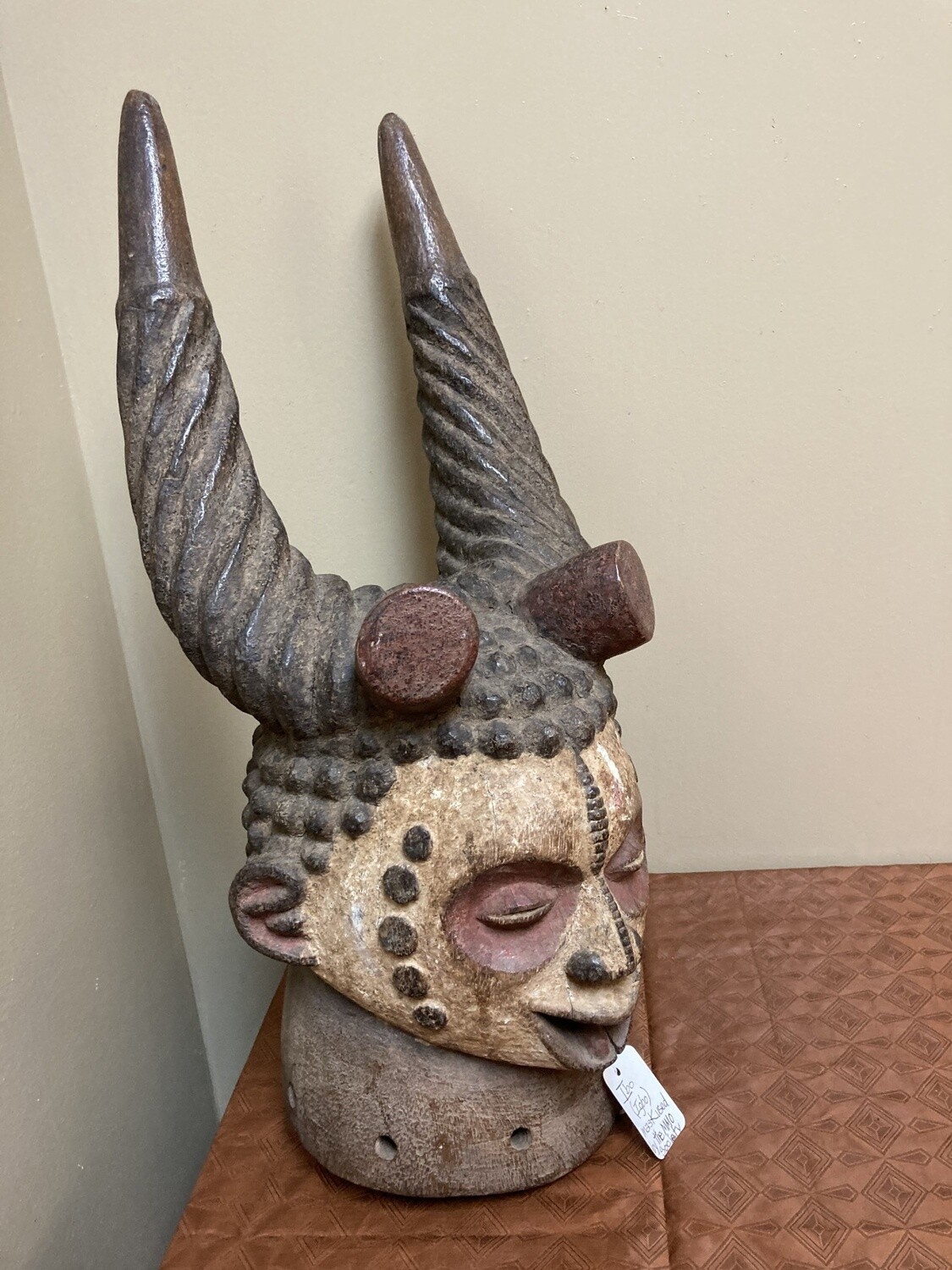 Ibo (igbo) headpiece/mask of wood, kaolin of red pigment that had use in the powerful men&#39;s secret society called mmo or mwo or mwa. It is 20 1/2&quot; tall and 9/14&quot; w. The Ibo live in the South east of N