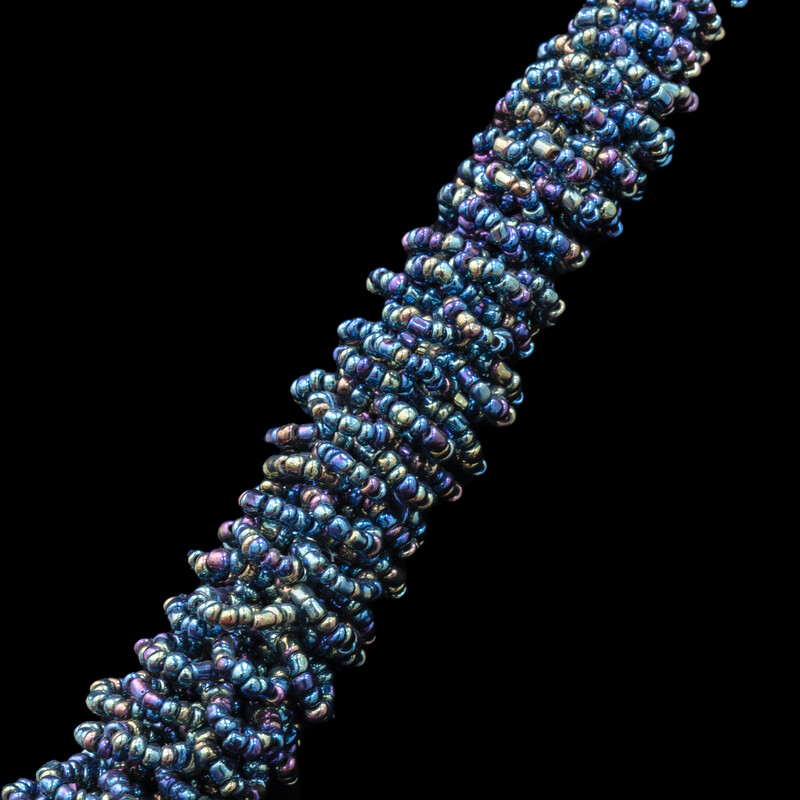 Intricate, woven beaded necklace.