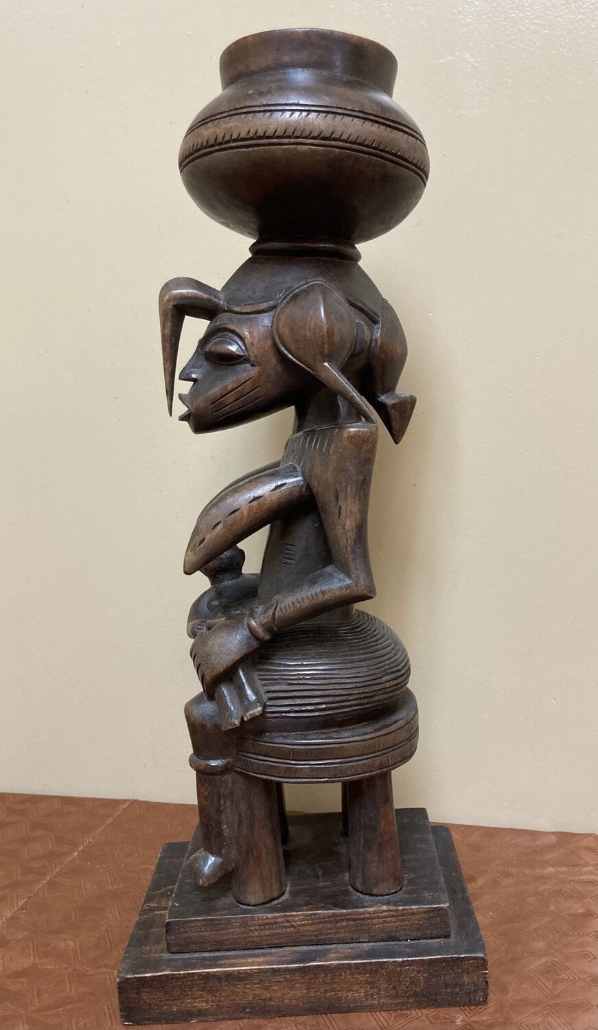 Senufo maternity figure: She references the &quot;Calao&quot; (the hornbill bird), the bird is revered for it&#39;s devoted parenting. Wood. 19 1/2 tall&quot; 7 1/4&quot; deep. North central Ivory Coast or Cote D&#39;ivoire