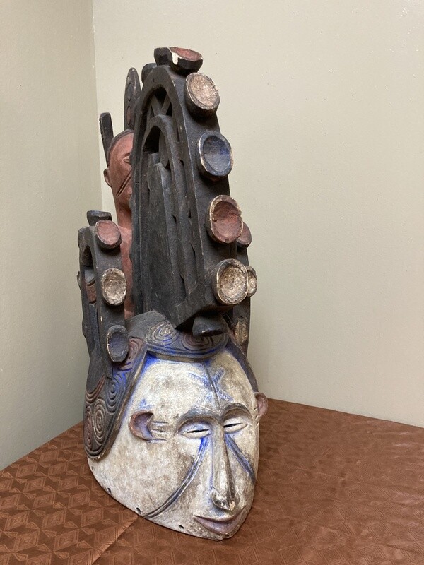 Ibo (Igbo) “Spirit Maiden” mask representing a beautiful young maiden. These masks are danced by men. The Ibo live in the south east of nigeria. 22&quot; tall x 17 1/2&quot; deep x 7&quot; w. $435