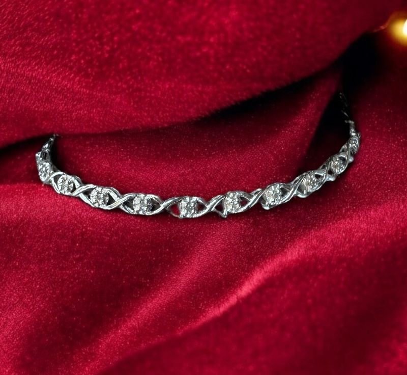 10kt White Gold Diamond Bracelet with infinity XO design