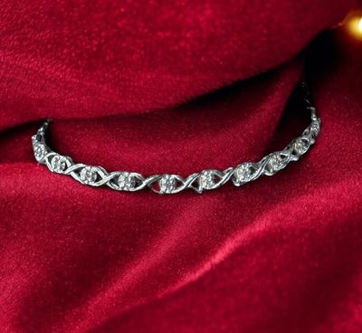 10kt White Gold Diamond Bracelet with infinity XO design