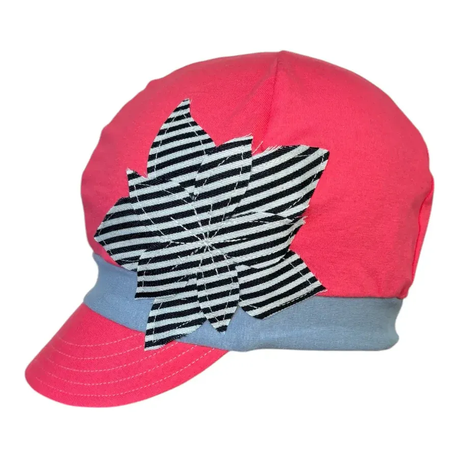 bright coral colored cap with striped flower on side