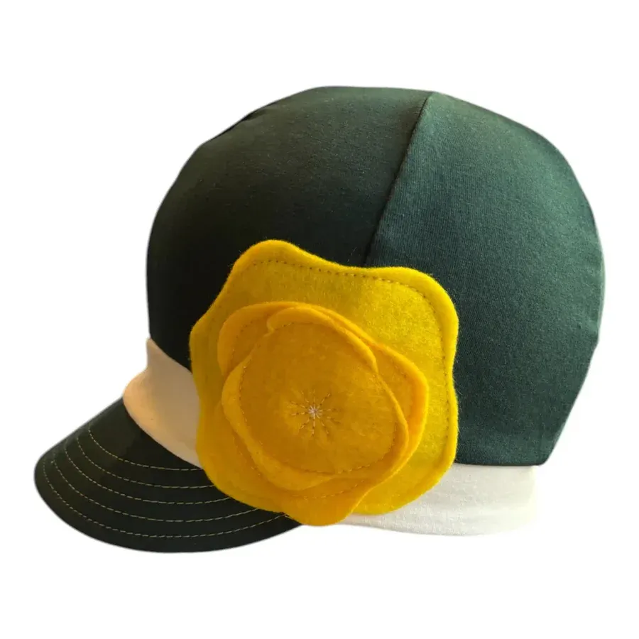 green stretchy cotton cap with white band and yellow flower on side