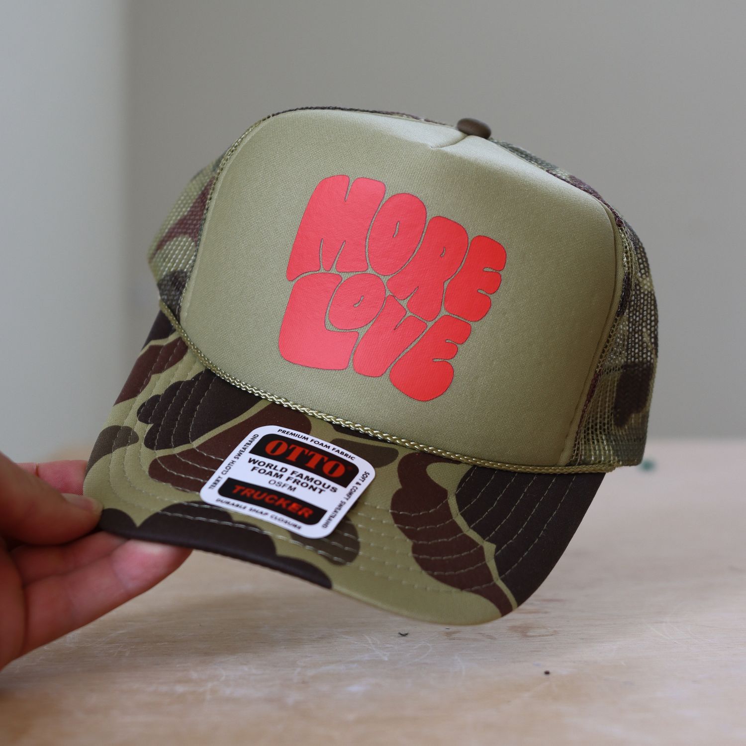 More Love Trucker Hat - Camo/Red