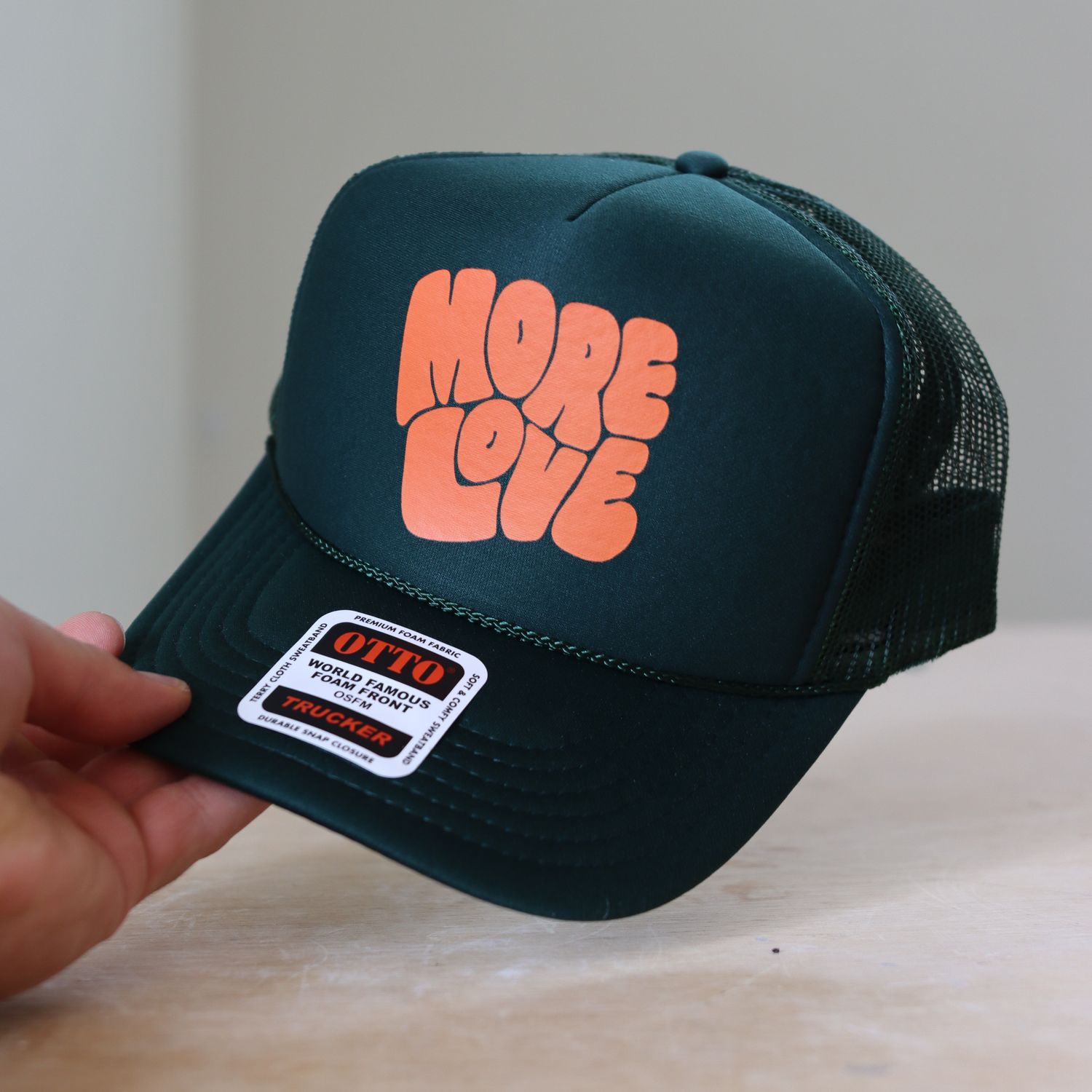 More Love Trucker Hat - Emerald/Orange