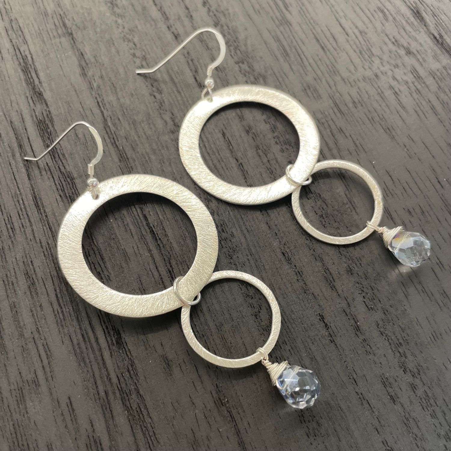 Eva Earrings, Finish: Brushed Silver/.925 Sterling Silver ear wires, Stone: Blue Crystal drop