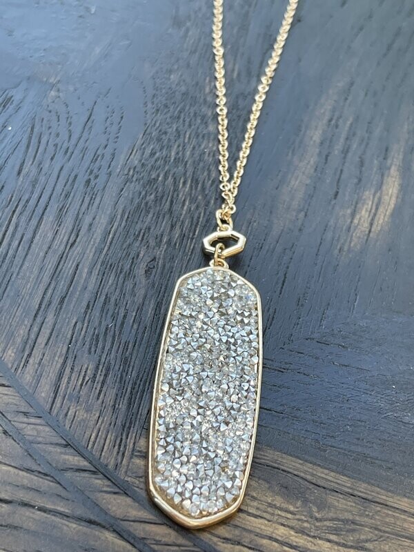 Long Dangle Charm with Rhinestones in it on a Gold Chain