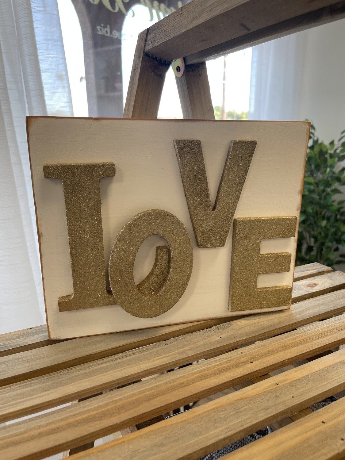 "LOVE" in Gold Glitter Letters  on White Wood Block