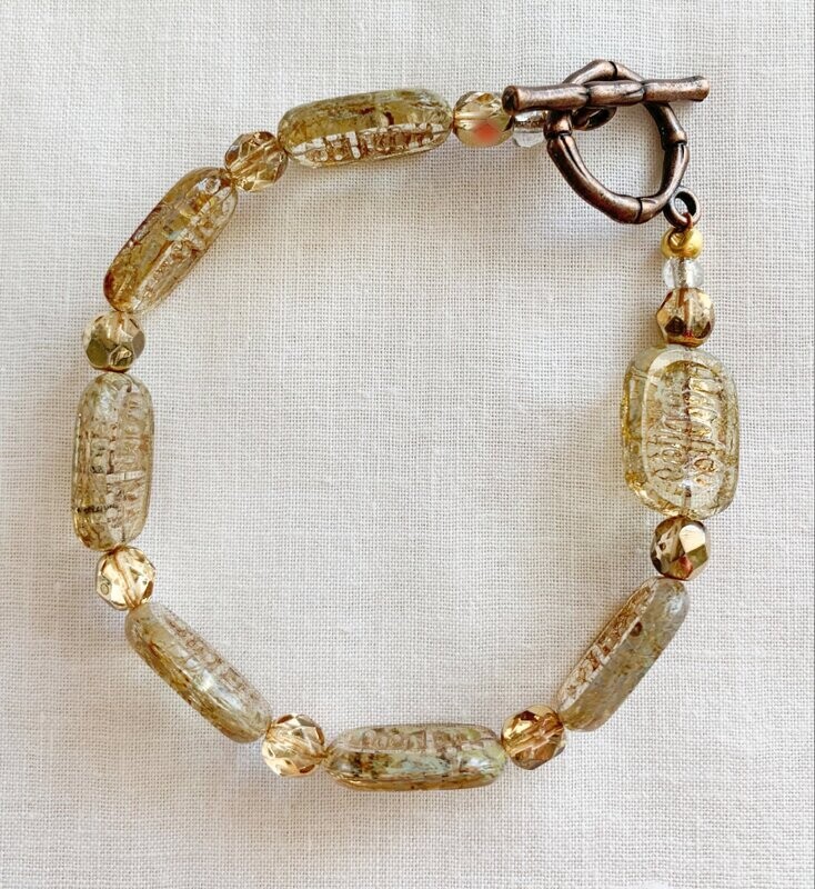 AMBER CZECH BEAD WITH BRASS TOGGLE