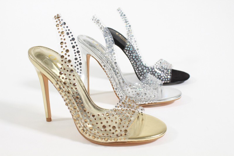 Royalty heels in silver, black, and gold with transparent studded straps and high heel for glamorous style.