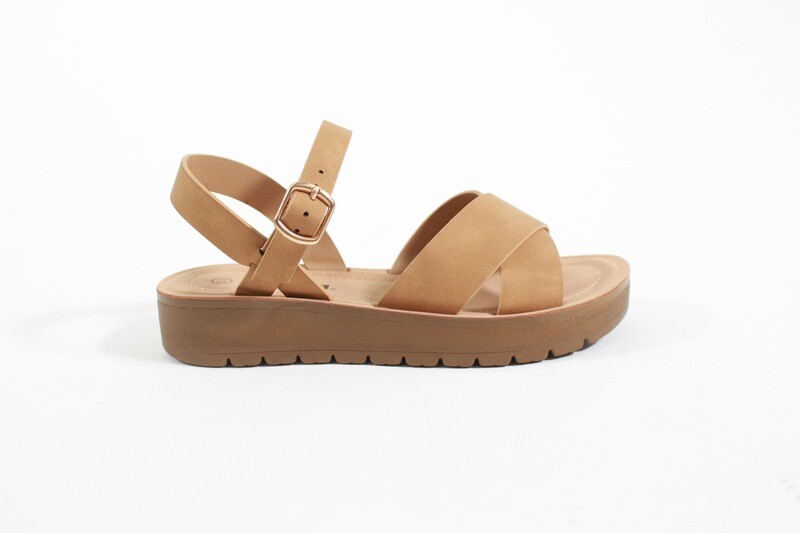 Comfortable tan women’s platform sandals with wide crisscross straps and buckle; available in black and white too.