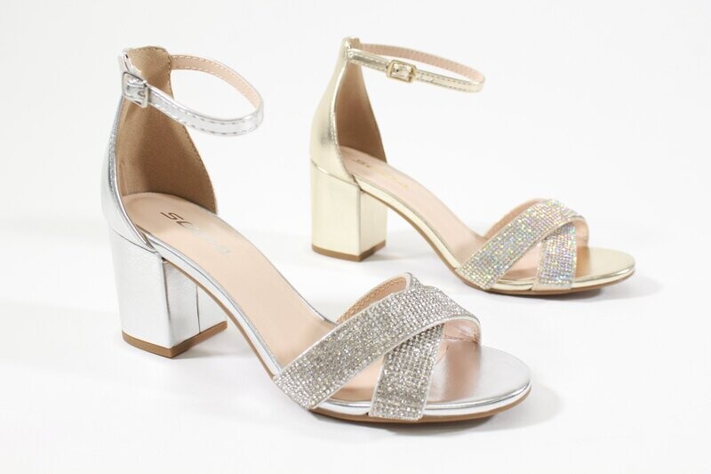 Transparent block heels with clear straps and high-shine finish for modern, head-turning style.