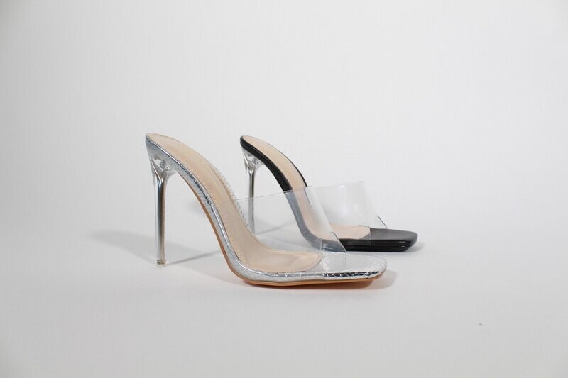 Itzy heels by Olivia with clear upper and silver stiletto heel, shown in both black and shimmering silver.