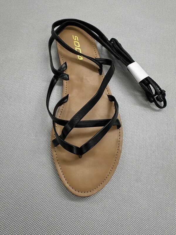 Black Voting sandals by Soda with wraparound ankle rope strap and streamlined open-toe silhouette.