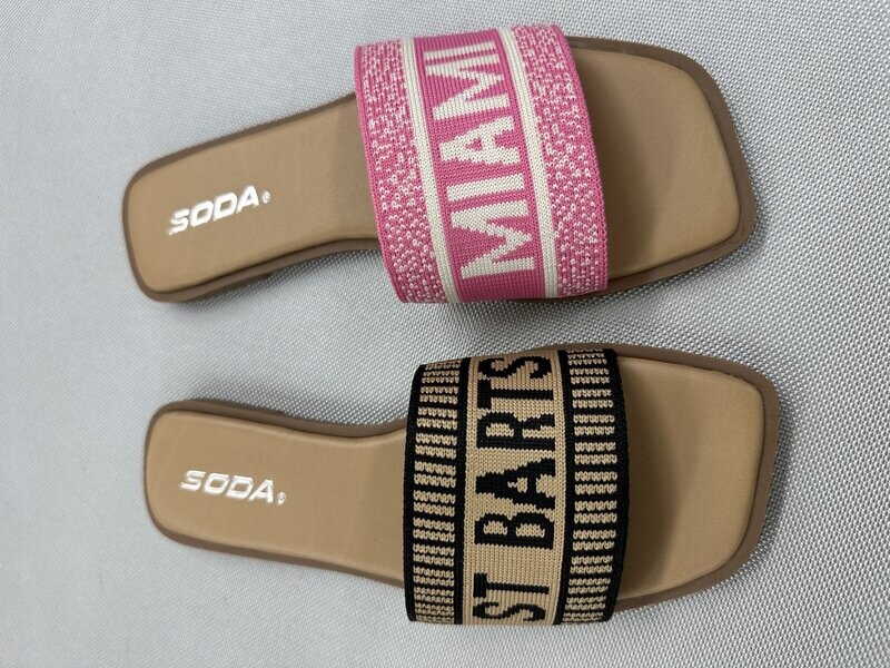 SODA Flair flat sandals in black/natural with “St. Barts” strap and pink/bone with “Miami” print design.