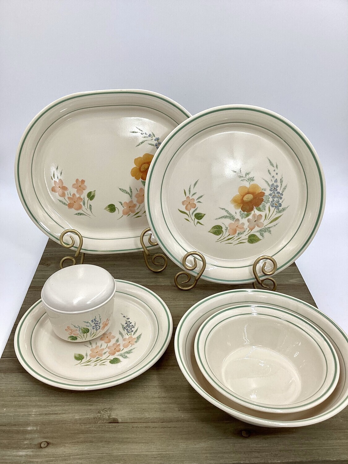 Discontinued Glenora Dinner and Luncheon Plates from the Corning Cornorstone Collection. These vintage serving dishes feature a distinctive green band adorned with delicate blue and peach flowers