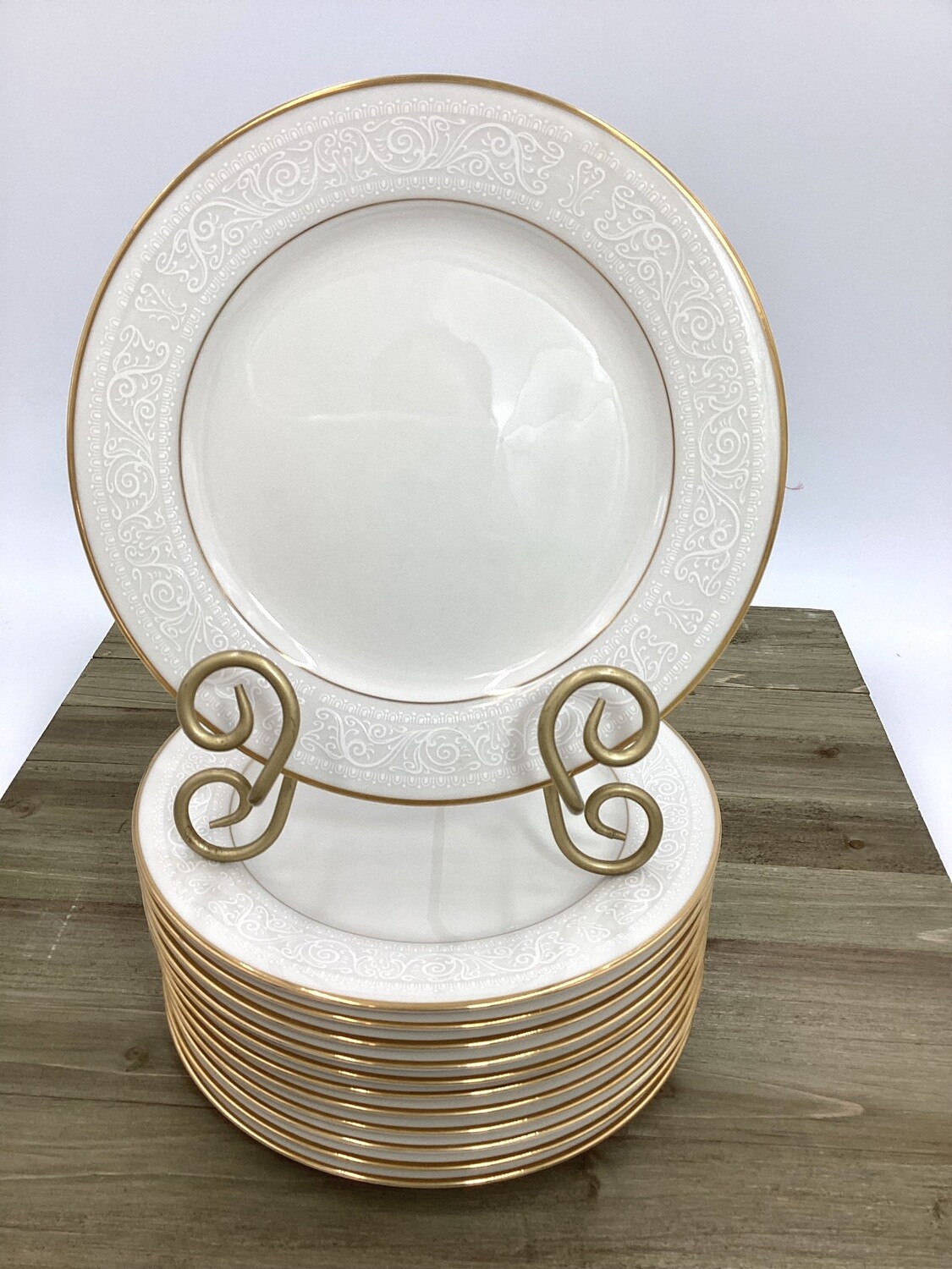 Set of 12 Noritake salad or dessert plates &quot;Tulane&quot; Ivory China Plates. Each plate features a harmonious blend of classic design and timeless charm.