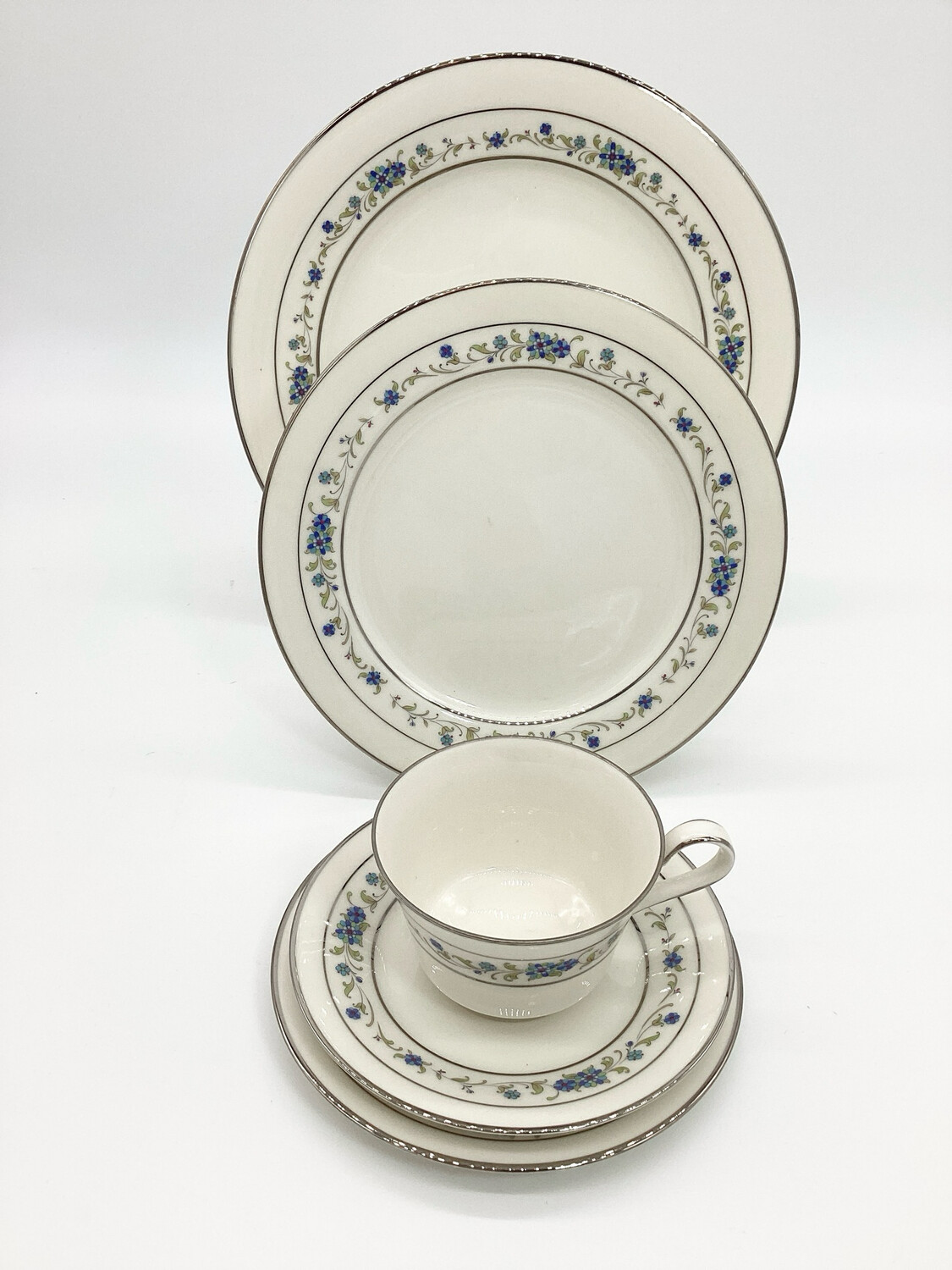 Noritake Ivory China 5-Piece place setting in the exquisite Norma Pattern 7016. This set includes a dinner plate, salad plate, bread plate, teacup, and saucer,