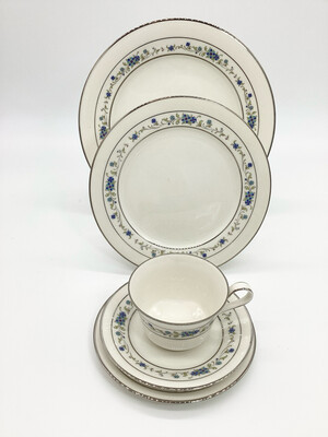 Noritake Ivory China 5-Piece place setting in the exquisite Norma Pattern 7016. This set includes a dinner plate, salad plate, bread plate, teacup, and saucer,