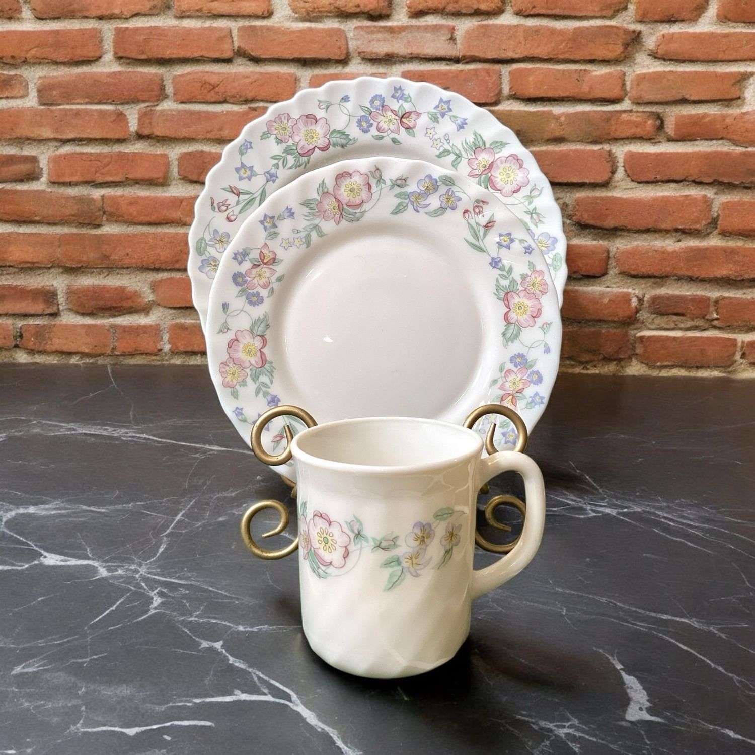Discover the timeless beauty of the Arcopal France Trio Set, featuring a dinner plate, salad/bread plate, and cup. Crafted with delicate artistry, this dinnerware set showcases a stunning floral design that adds a touch of elegance to your table.