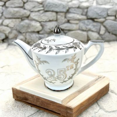 Celebrate 25 years of love and commitment with this exquisite 25th-anniversary teapot. A perfect way to mark your Silver Jubilee, this teapot is not just a functional item but a symbol of your enduring bond and a meaningful anniversary gift that will be cherished for years to come.