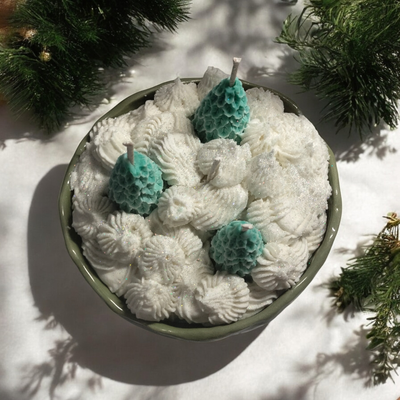 Christmas trees in snow in a ceramic bowl