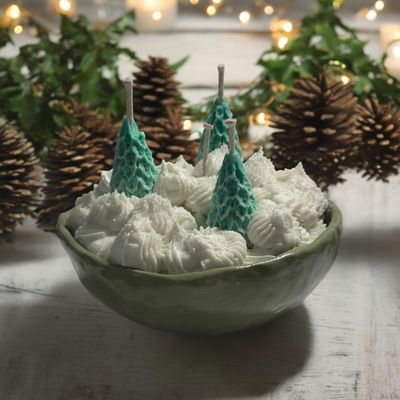 Christmas trees in snow in a ceramic bowl