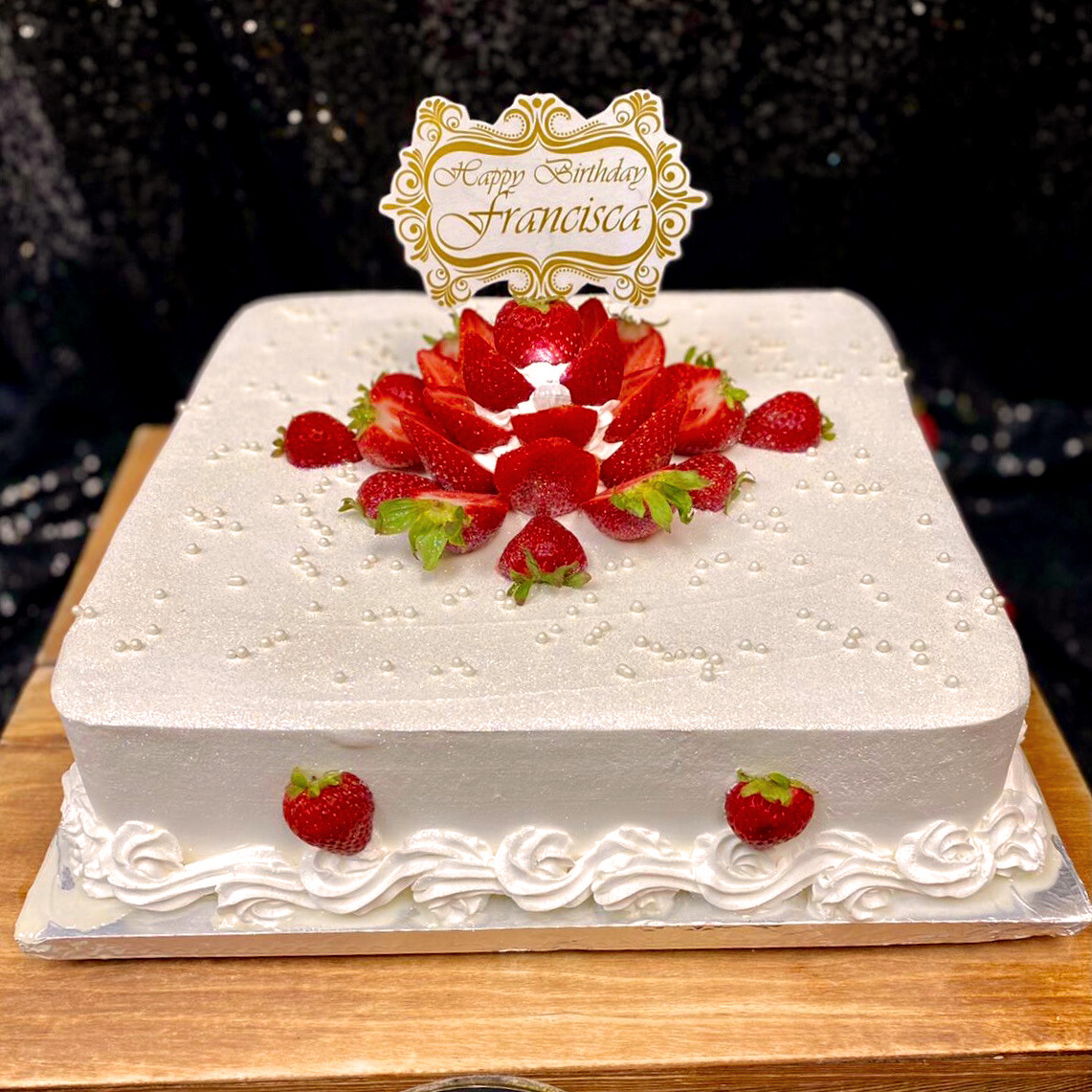 Strawberries on white Cake