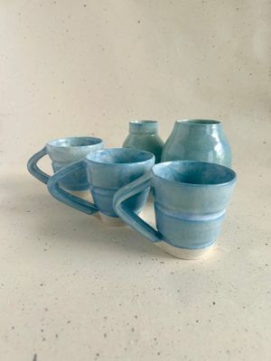 Blue mug with angled handle